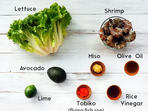 Ingredients for the salad labeled -- lettuce, shrimp, avocado, miso, olive oil, lime, tobiko, and rice vinegar