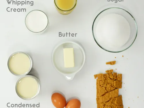 Ingredients for key lime pie labeled -- key lime juice, whipping cream, sugar, butter, condensed milk, eggs, and graham crackers