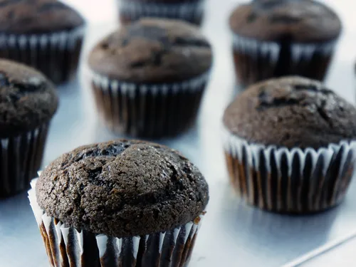 A tray of freshly baked, unfrosted chocolate Guinness cupcakes