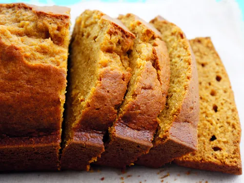 Close-up of sliced pumpkin bread showing its moist, spiced interior