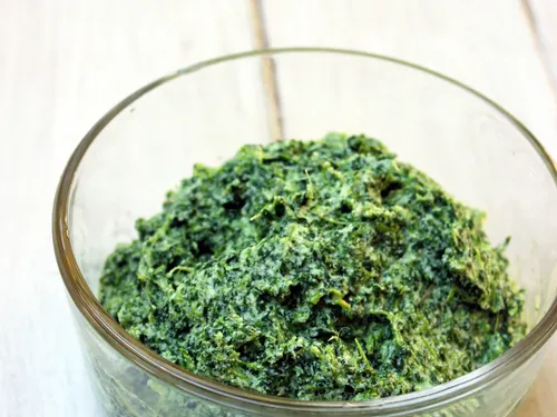 A bowl of mixed spinach and ricotta filling